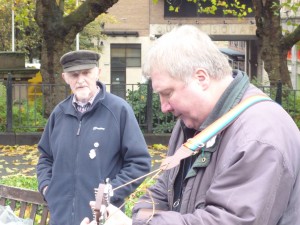 Neville Grundy performing peace songs and Gerry Poole background)